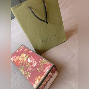 Gucci shopping bag, shoe box, and dust bags.